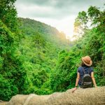 Girl sitting on a mountain