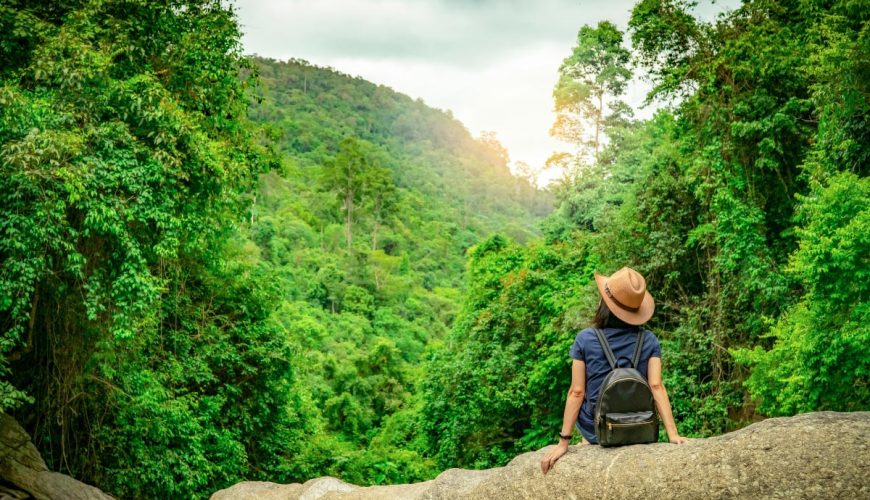 Girl sitting on a mountain