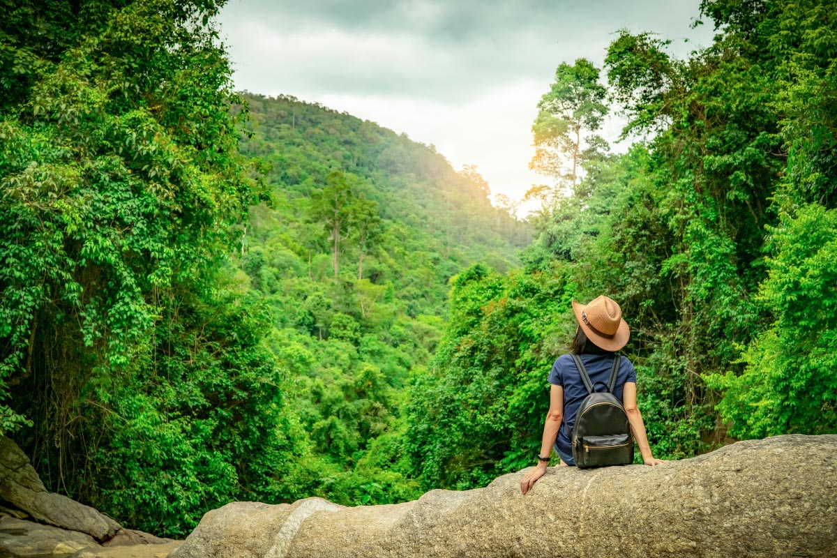 Girl sitting on a mountain